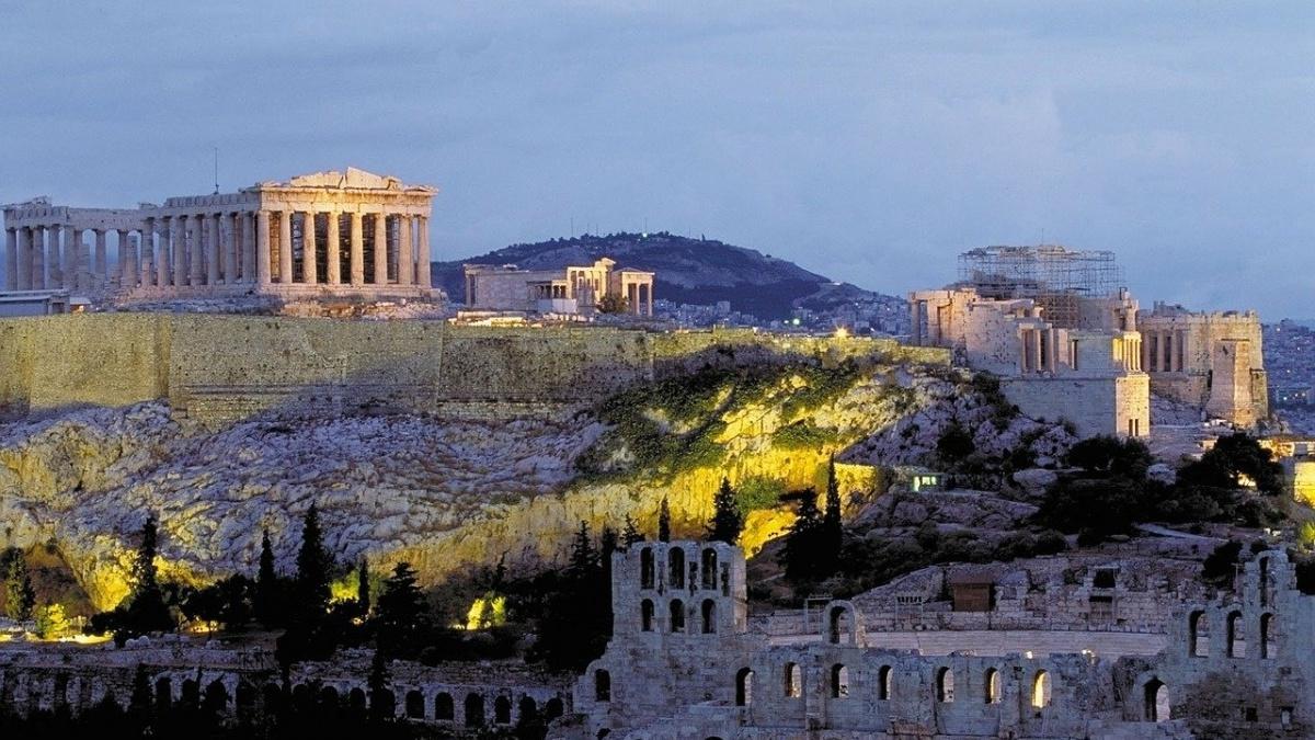Aerial view of Athens, Greece at sunset with the Acropolis in the distance